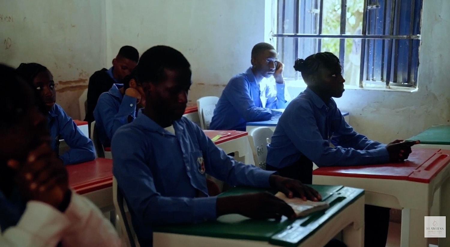 Students attentively learning in a classroom setting.